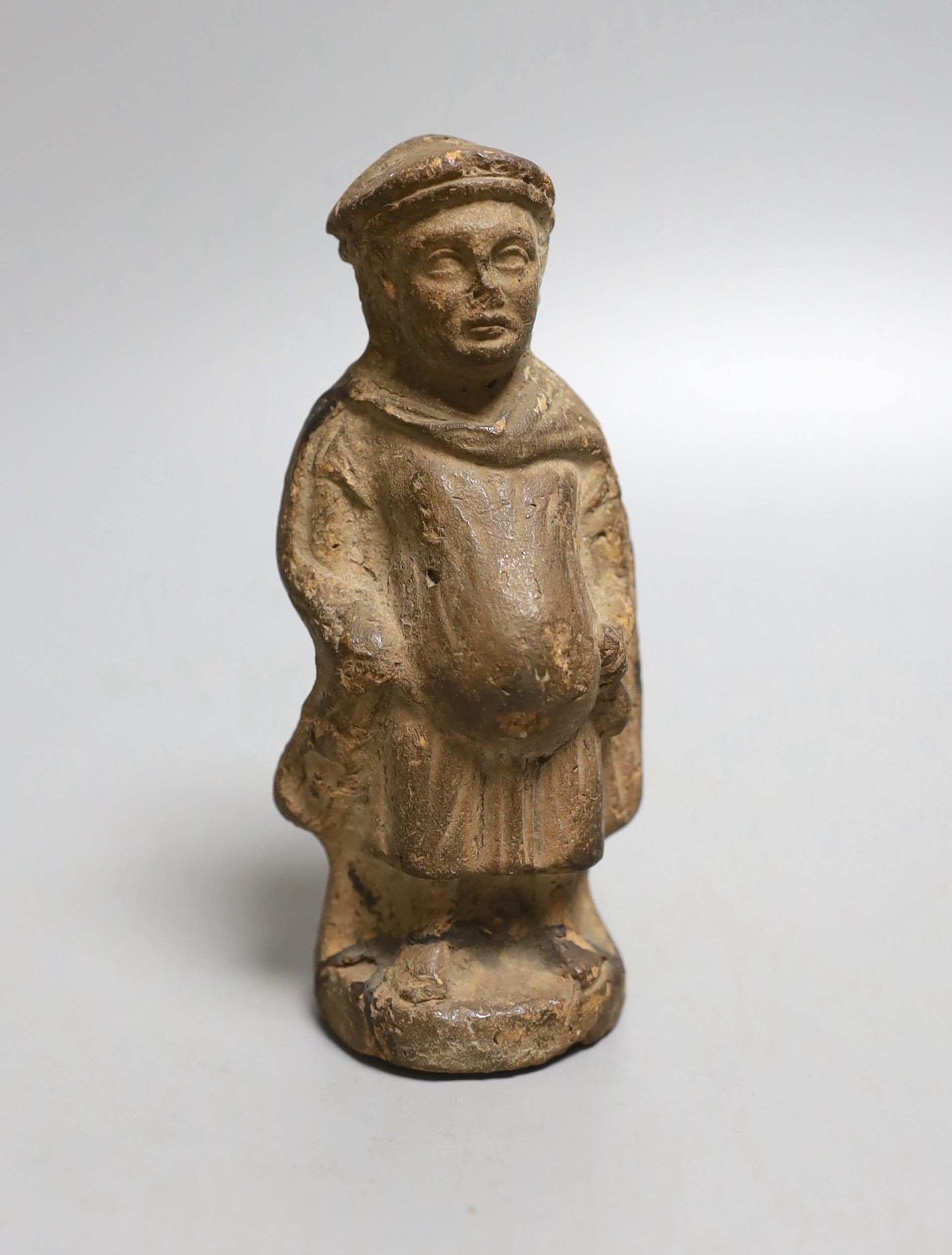 A terracotta figure of a man, possibly possibly mediaeval 13th century - 11cm tall